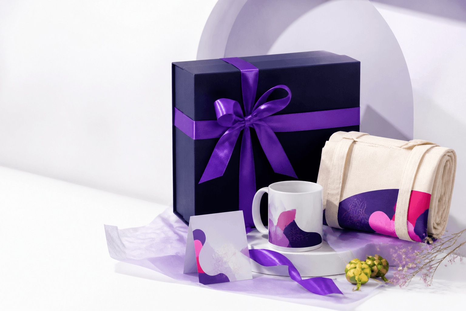 A premium gift box, personalised mug, tote bag and card in Arteka colours